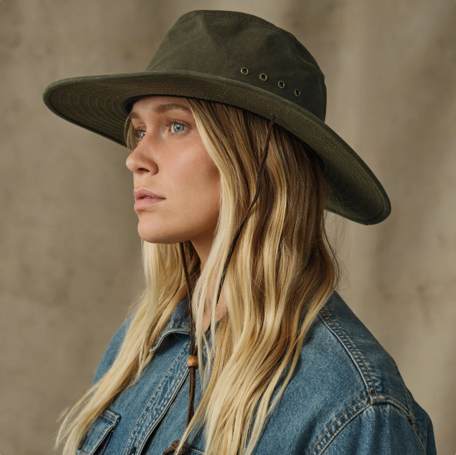 Woman in a wide-brim green hat