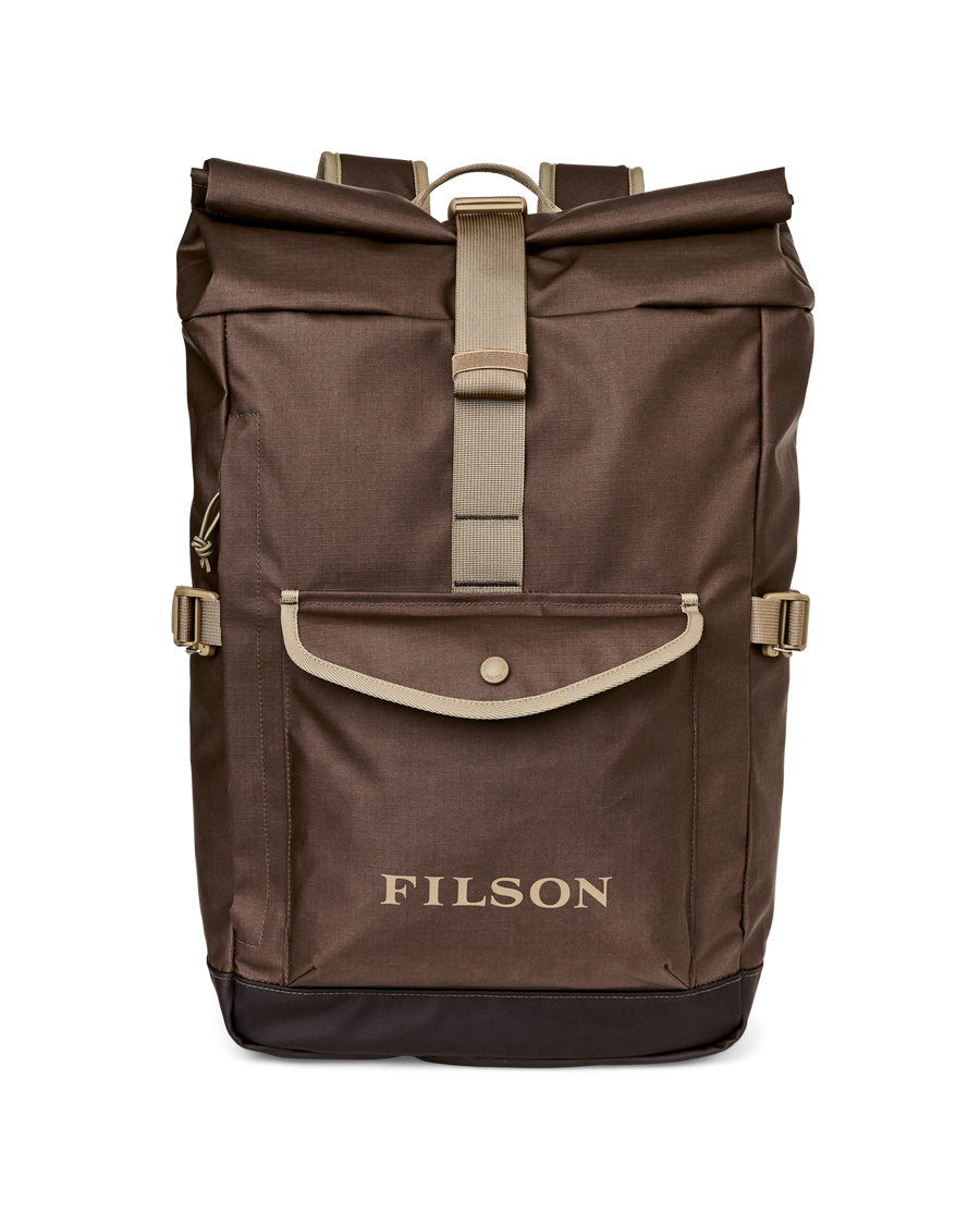 Brown roll-top backpack with a Filson patch